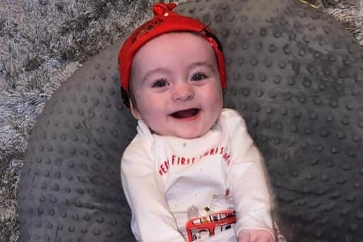 Lennon Charles, age 8 months, ready to celebrate Christmas.