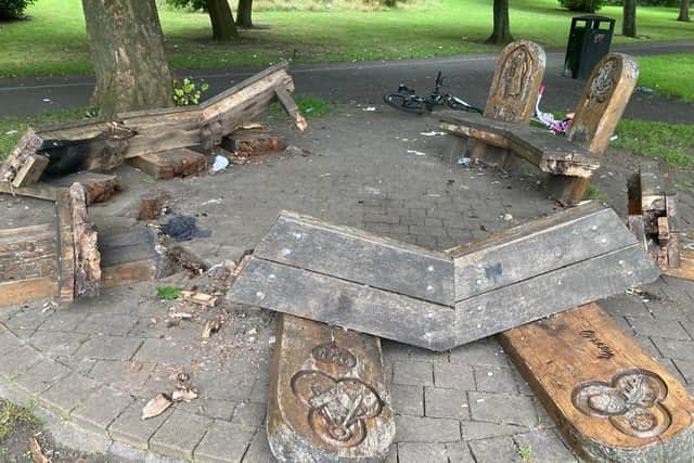 The destruction caused to the bench at the cemetery.