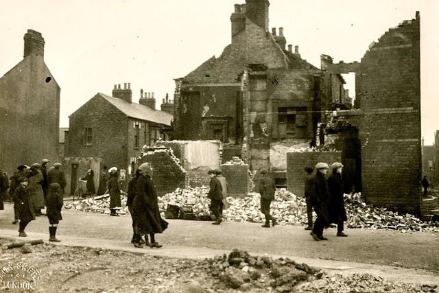 Onlookers walk past the ruined houses in Union Street. Photo: Hartlepool Museum Service.