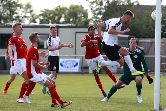 Jake Cooper of Gateshead scores the first goal during the Vanarama National League North Play-Off match between Brackley Town and Gateshead at St. James Park on July 19, 2020 in Brackley, England. (Photo by David Rogers/Getty Images)