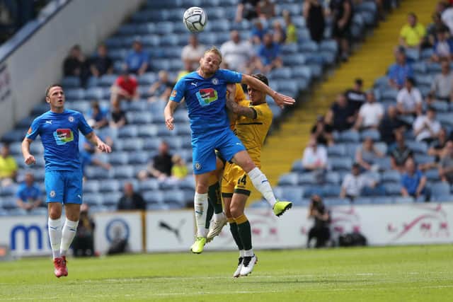 STOCKPORT, UK. JUNE 13TH  Scott Andrews of Stockport County contests a header with Gavan Holohan of Hartlepool United during the Vanarama National League match between Stockport County and Hartlepool United at the Edgeley Park Stadium, Stockport on Sunday 13th June 2021. (Credit: Mark Fletcher | MI News)