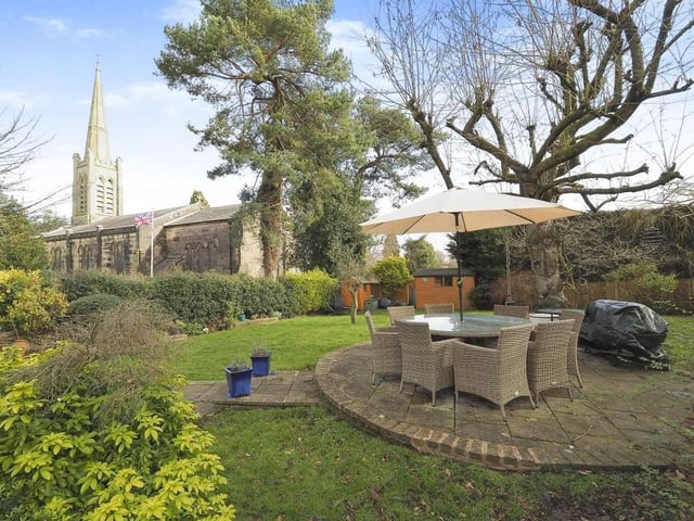 How gorgeous does this back garden look? Not just because of the views of St James's Church but also because of the circular patio area in the middle of the lawn. The shrubs and trees aren't bad either, are they?