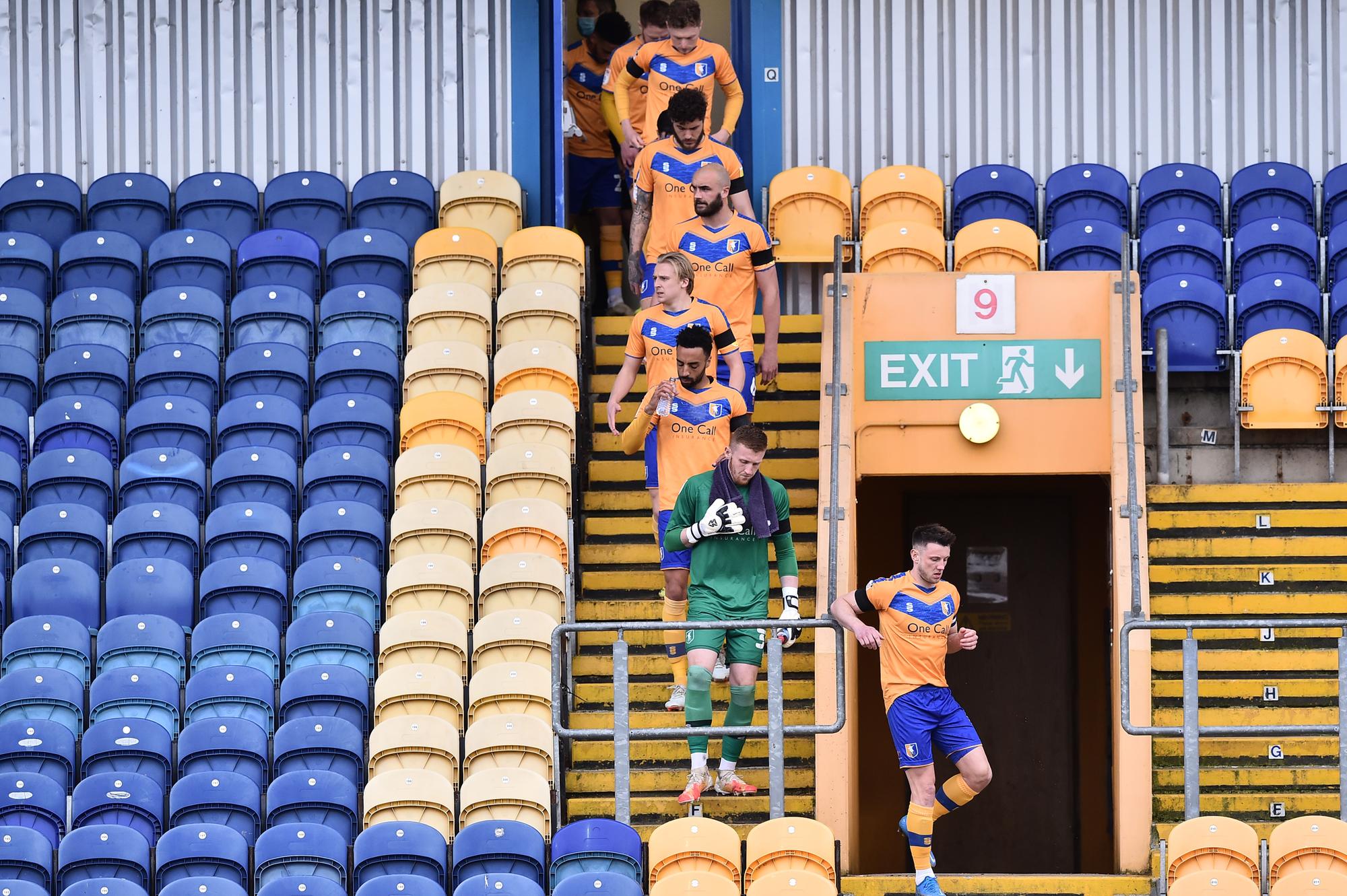 Mansfield Town make their way to the pitch.