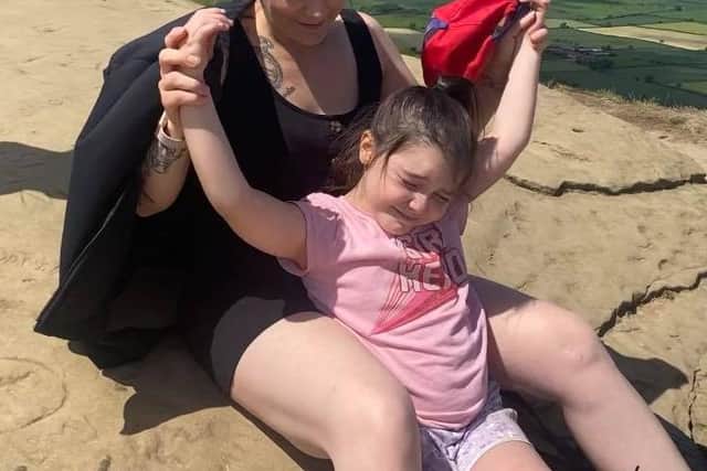 Kirsty O'Donovan and daughter Lyla on the top of Roseberry Topping on the last day of Kirsty's one million step challenge.