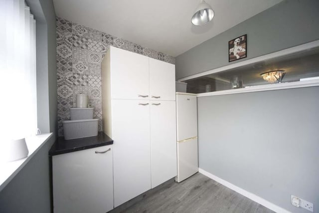 The useful utility room provides extra space form more appliances.