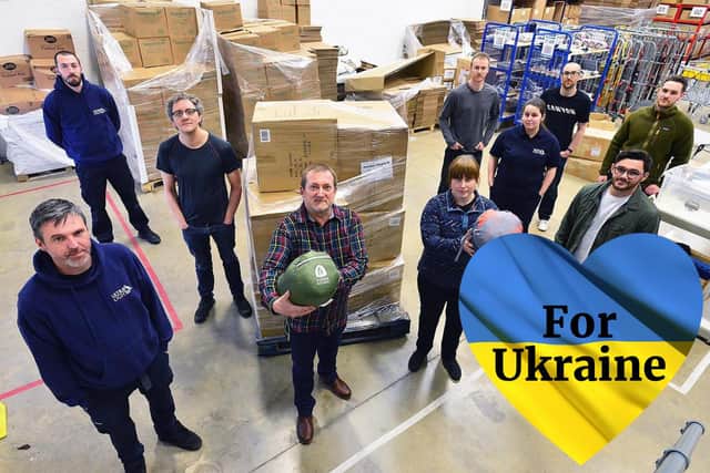 Staff from Ultralight Outdoor Gear with a pallet of sleeping bags for the people of Ukraine.