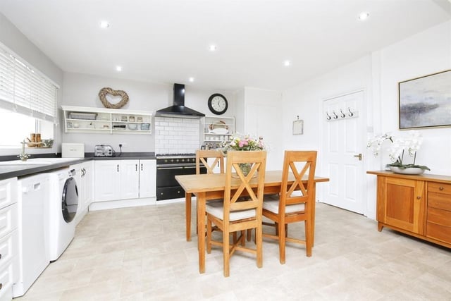 The kitchen is fitted with a range of units and has easy access to the rear garden.