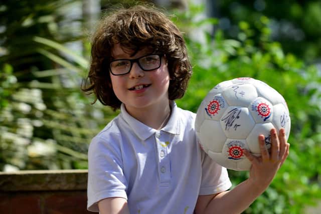 George won the Hartlepool United ball and now wants to donate it for a good cause.
