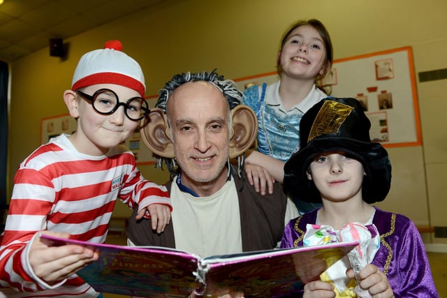 Lynnfield Primary School staff member, Brian Umpleby, celebrates World Book Day in 2019 with pupils Alex Burn-MCrossen, Jade Chawner and Riley Stead.