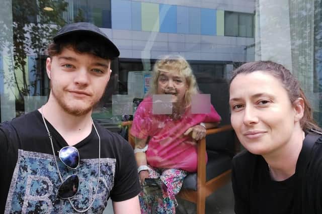 Mandy Andrews, centre, with son Harry and god daughter Sarah Lewis at the Freeman Hospital where she is fighting complications with her heart and kidney, and a serious lung infection.