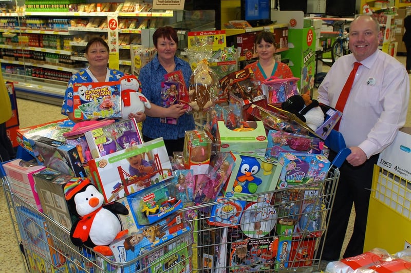 Tesco, Burn Road deputy manager Darren Pickering presented University Hospital of Hartlepool staff (left to right) Lynne Scott, Sandra Topping and Chris Goodwin with children's toys for Christmas in 2010. Picture by FRANK REID