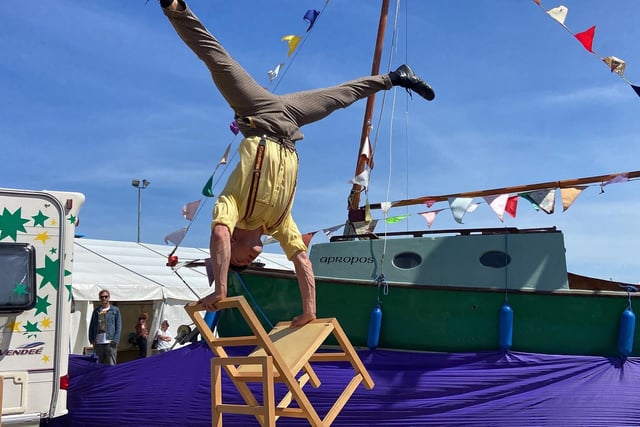 A performer does a handstand. Picture by FRANK REID