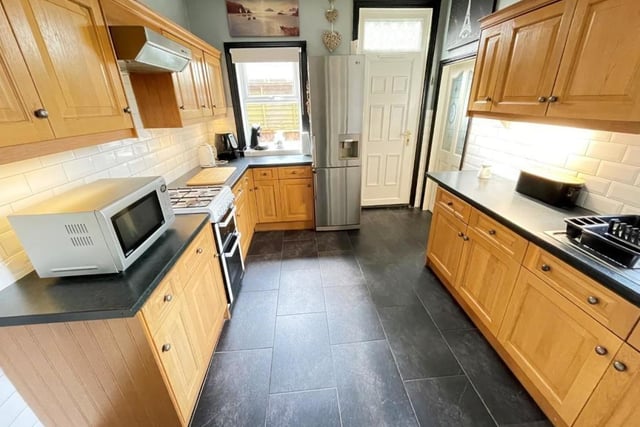 The kitchen is fitted with  a quality range of 'oak' style units.