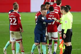 Derby's Wayne Rooney greets the officials after his side's defeat at Middlesbrough.
