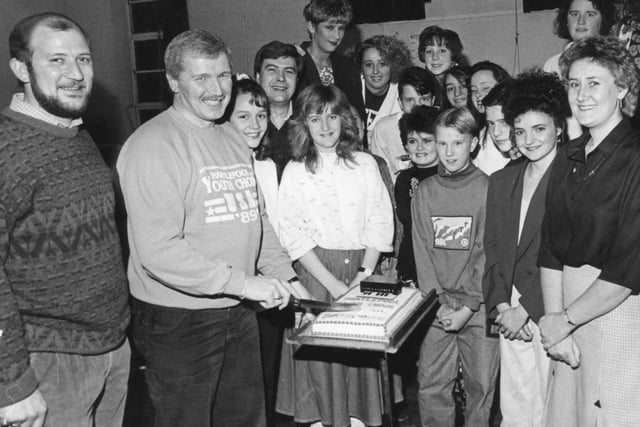 Hartlepool's youth choir leader, Chris Simmonds, cuts the cake at a reunion party to celebrate the choir's 20th birthday in January 1990.