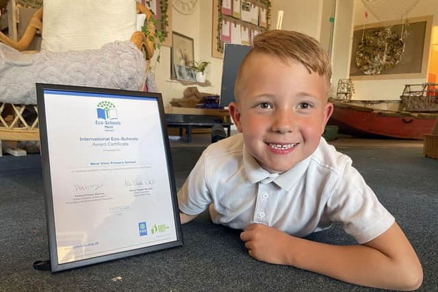 West View Primary School pupil Leo Robinson proudly displays the Echo-Schools certificate.