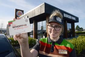 Burger King staff member Beth Renwick holding free Whopper vouchers outside of the new restaurant on Hartlepool's Tees Bay retail park. Picture by FRANK REID