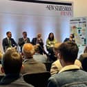 Hartlepool MP Jonathan Brash, seated centre on stage, speaks at a New Statesman event at the Labour Party conference.