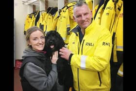 Danielle Austin and Hartlepool RNLI crewmember Rob Archer with his dog 'Buddy'./Photo: RNLI/Tom Collins