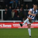 Hartlepool United's David Ferguson crosses a ball during the League Two fixture with Grimsby Town. (Credit: Michael Driver | MI News)