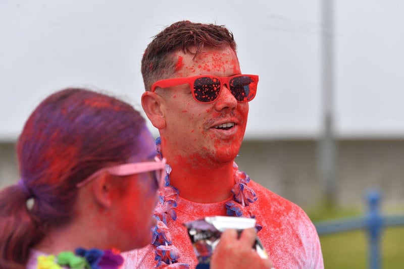 A runner covered in red paint.