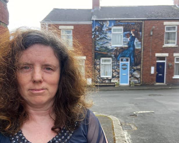 Arlene Childs stands in front of the mural she had painted on the front of her house in Ninth Street, Blackhall. Arlene and her husband Stephen are trying to regenerate the area and have commissioned a number of murals to be painted across Blackhall.