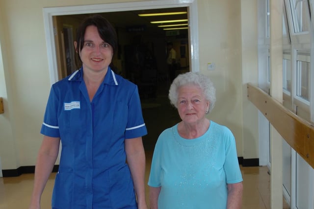 Dorothy Caffey takes a stroll alongside chemotherapy nurse, Rosie Livingston-Leak.