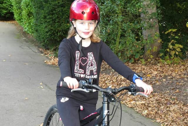 Phoebe, aged seven, is riding 103 times around Ward Jackson Park to raise money.