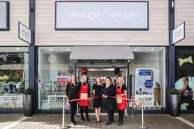 Store manager Marta Horvathovas cuts the ribbon, watched by (from left) Jackie Johnson; Steff Rogerson; area manager Nikki Martin and Fiona Embleton