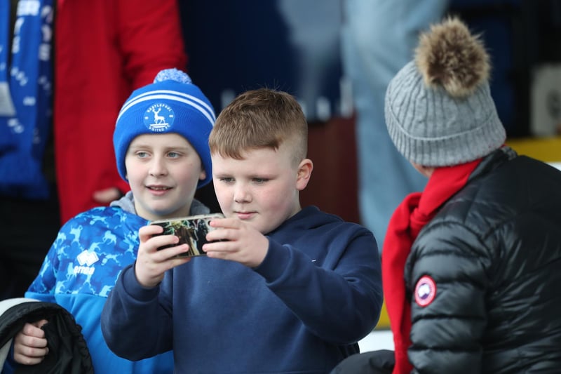 This youngster is capturing memories of the match against Barnet.