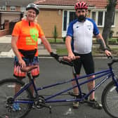 Phil Holbrook (left) and Darrel Slater get ready to ride the tandem.