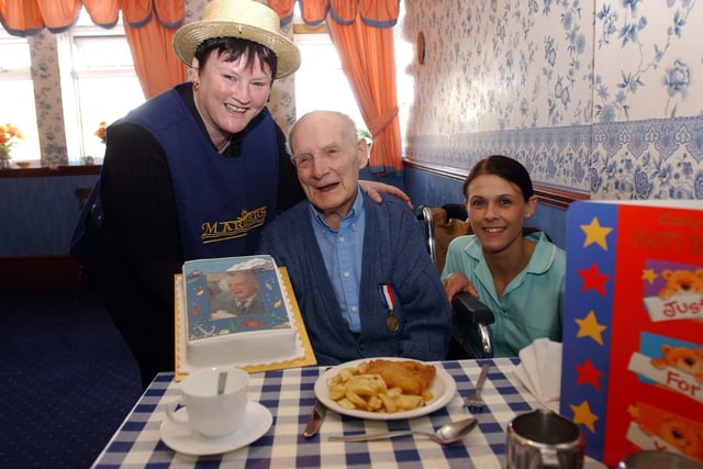103-year-old Josepher Savage celebrates his birthday with chips and cakes at Mariners in 2003.