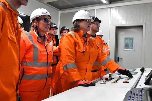 Hartlepool MP Jill Mortimer (centre) presses the button to start the production process at STRABAG. Photo: Frank Reid
