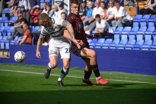 Will Goodwin of Hartlepool United FC is tackled by Peter Clarke of Tranmere Rovers FC during the Sky Bet League 2 match between Tranmere Rovers and Hartlepool United at Prenton Park, Birkenhead on Saturday 4th September 2021. (Credit: Ian Charles | MI News)