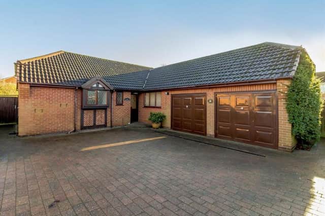 This three-bedroom, detached bungalow at The Hollies in Rainworth is on the market for around £250,000. As you can see, the driveway at the front leads to an integral double garage.