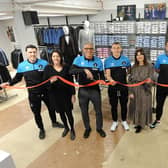Hartlepool manager Keith Curle cuts the ribbon during the official opening of the Suit Direct store, Also pictures are Hartlepool United players (let to right) Callum Cooke, David Ferguson and Mathew Dolan along with Suit Direct's Helen Gething, Amanda Argent, Nick Scott and Stacey Matthews. Picture by FRANK REID