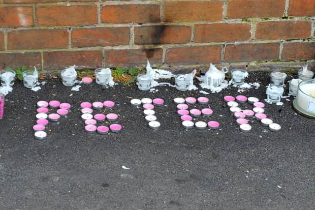 Candles spell out Peter in tributes at the scene of the stabbing in Hamilton Avenue, Leeds. Picture Steve Riding