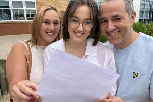 Olivia Prout with mum Claire and dad Neil as she collected her GCSE results from Wellfield School. Picture by FRANK REID