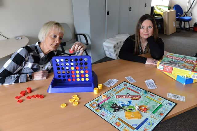 Denise Bell (left) support Worker and Rachael Oliver General Manager from Pathways To Independence, playing a game. Picture by FRANK REID
