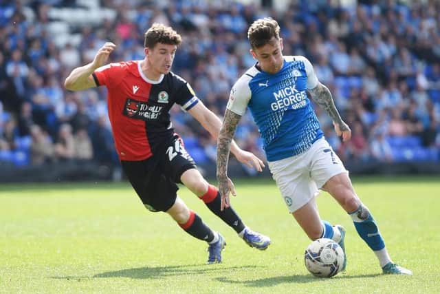 Sammie Szmodics of Peterborough United is challenged by Darragh Lenihan. (Photo by Harriet Lander/Getty Images)
