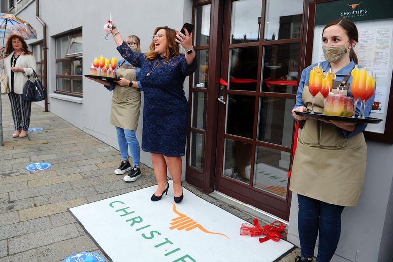 Barbara Bryceland helps with the ribbon cutting ceremony at Christie's, Falkirk. Picture: Michael Gillen.