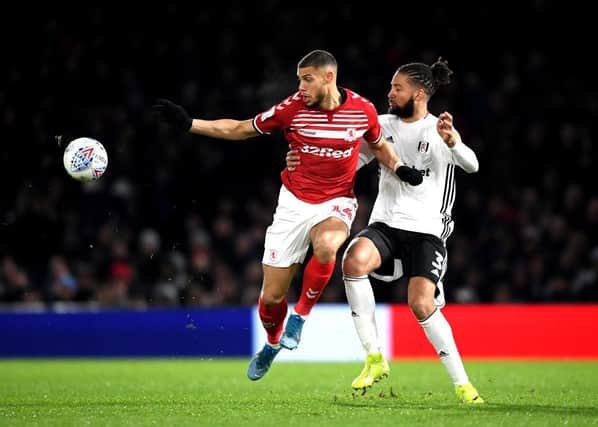LONDON, ENGLAND - JANUARY 17: Michael Hector of Fulham and Rudy Gestede of Middlesbrough  during the Sky Bet Championship match between Fulham and Middlesbrough at Craven Cottage on January 17, 2020 in London, England. (Photo by Alex Davidson/Getty Images)