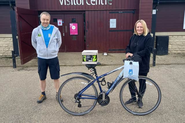 Keith Carter from the Hartlepool Cycle Clinic with 1,000th customer Louise Tate.