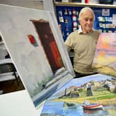 Alan Pearson from Ord Office Ltd with the three donated paintings. Picture by FRANK REID.