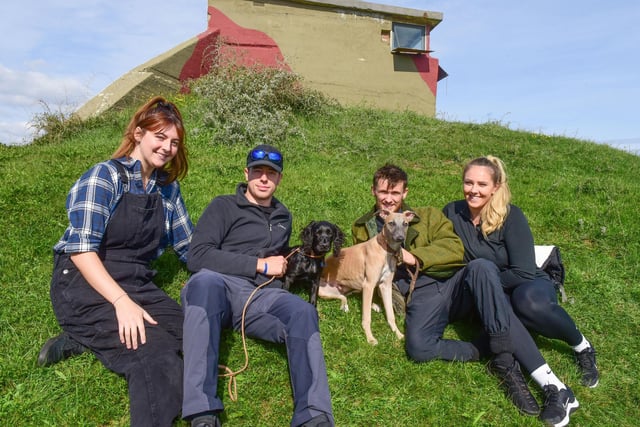 Left-right: Leigh Turner, Max Lancaster, Ryan Anderson and Chloe Bowman and their dogs Koba and Alfie at the Heugh Battery.