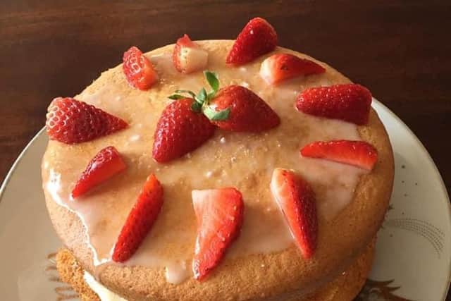 A strawberry cake baked by Joane's sister Kathleen that started the idea for the Facebook group.