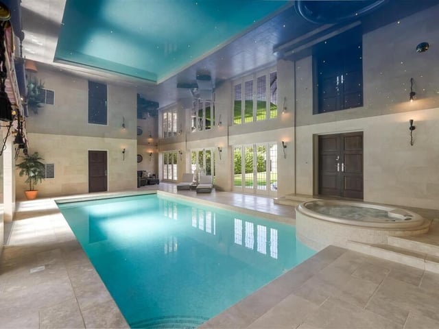 This home has a large indoor pool, sauna and hot tub.