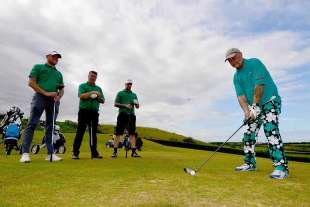 Ian Bolton tees off at High Throston Golf course as fellow golfers (left to right) Mally and Liam Bolton also Michael Lamb look on. Picture by FRANk REID