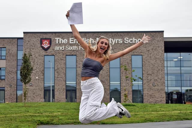 Elisha jumps for joy as she collects her GCSE results from English Martyrs School. Picture by BERNADETTE MALCOLMSON