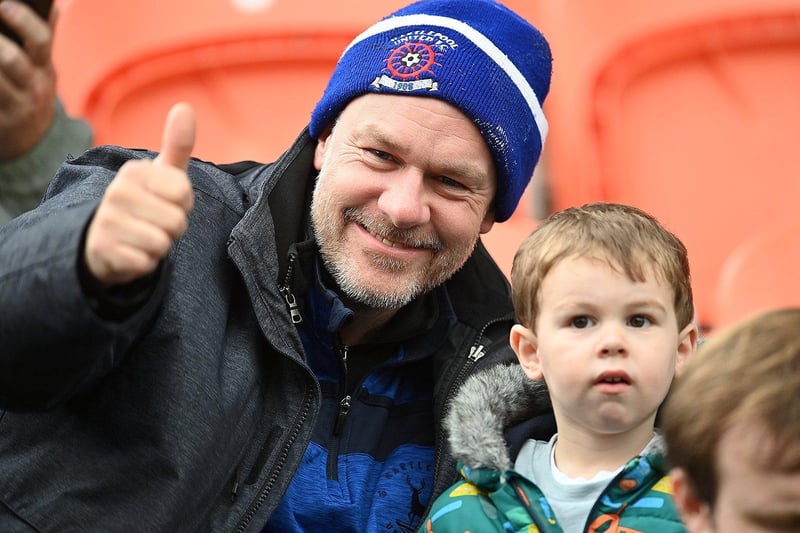 Two Hartlepool United fans at the club's first match of the 2023-24 season at Barnet following their return to the National League.